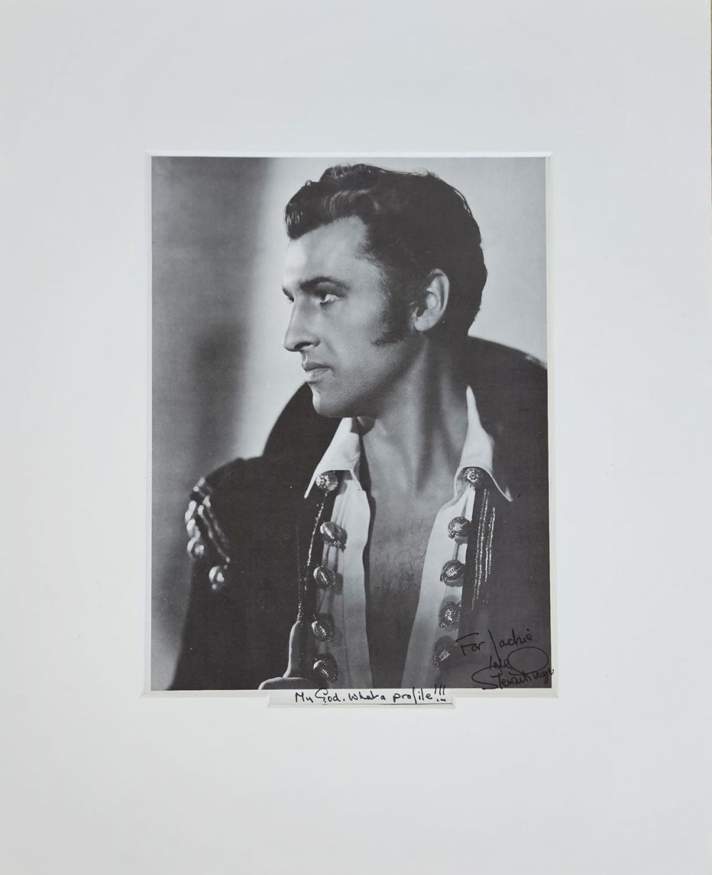 Lot 122: Stewart Granger signed colour black and white photo...
