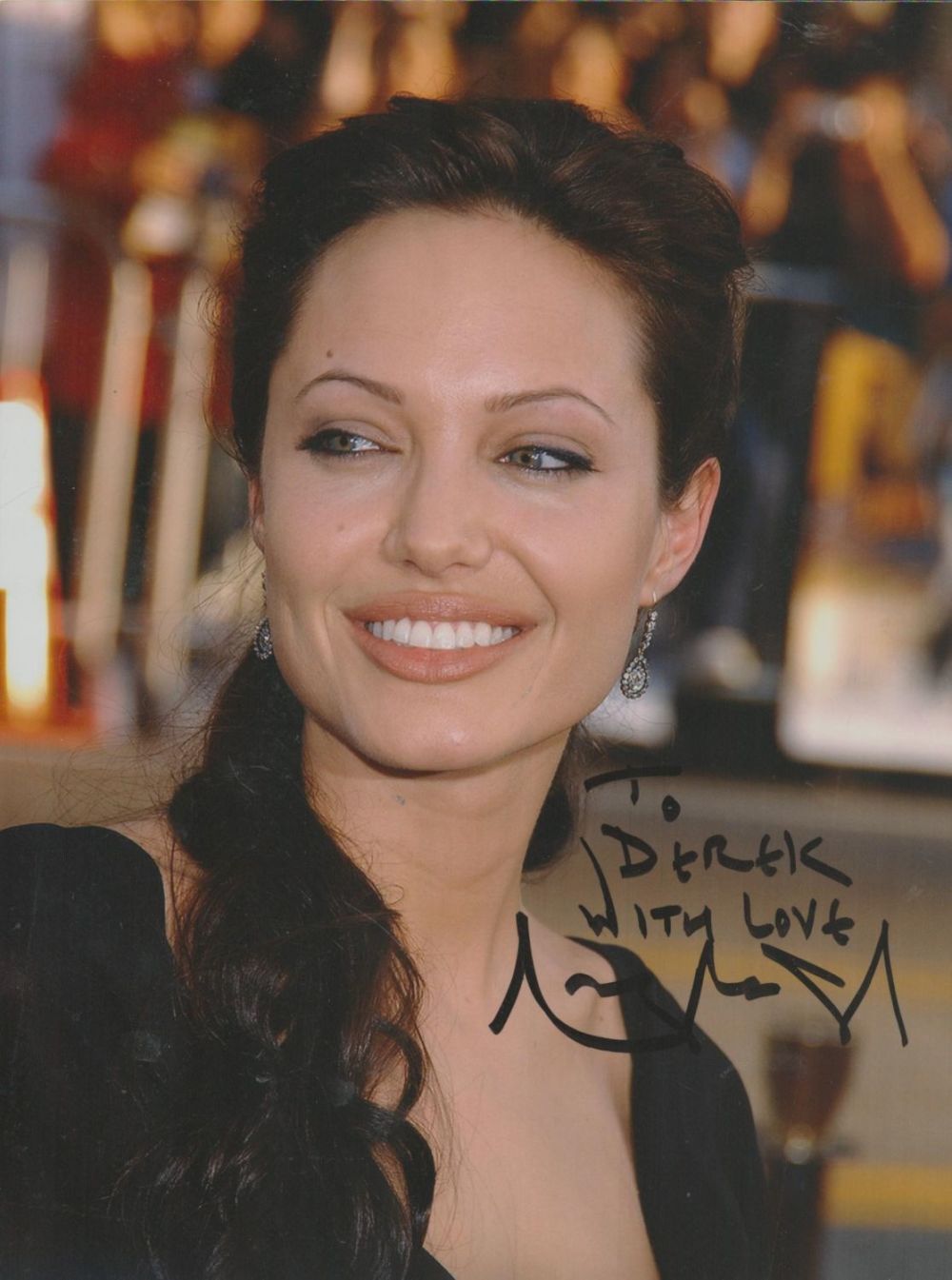 Lot 271: Angelina Jolie signed 8x6inch colour photo. Good condition....