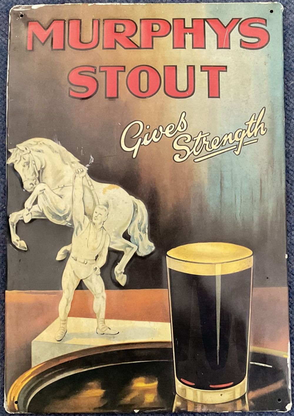 Lot 430: Vintage Murphys Stout Gives Strength metal pub sign....