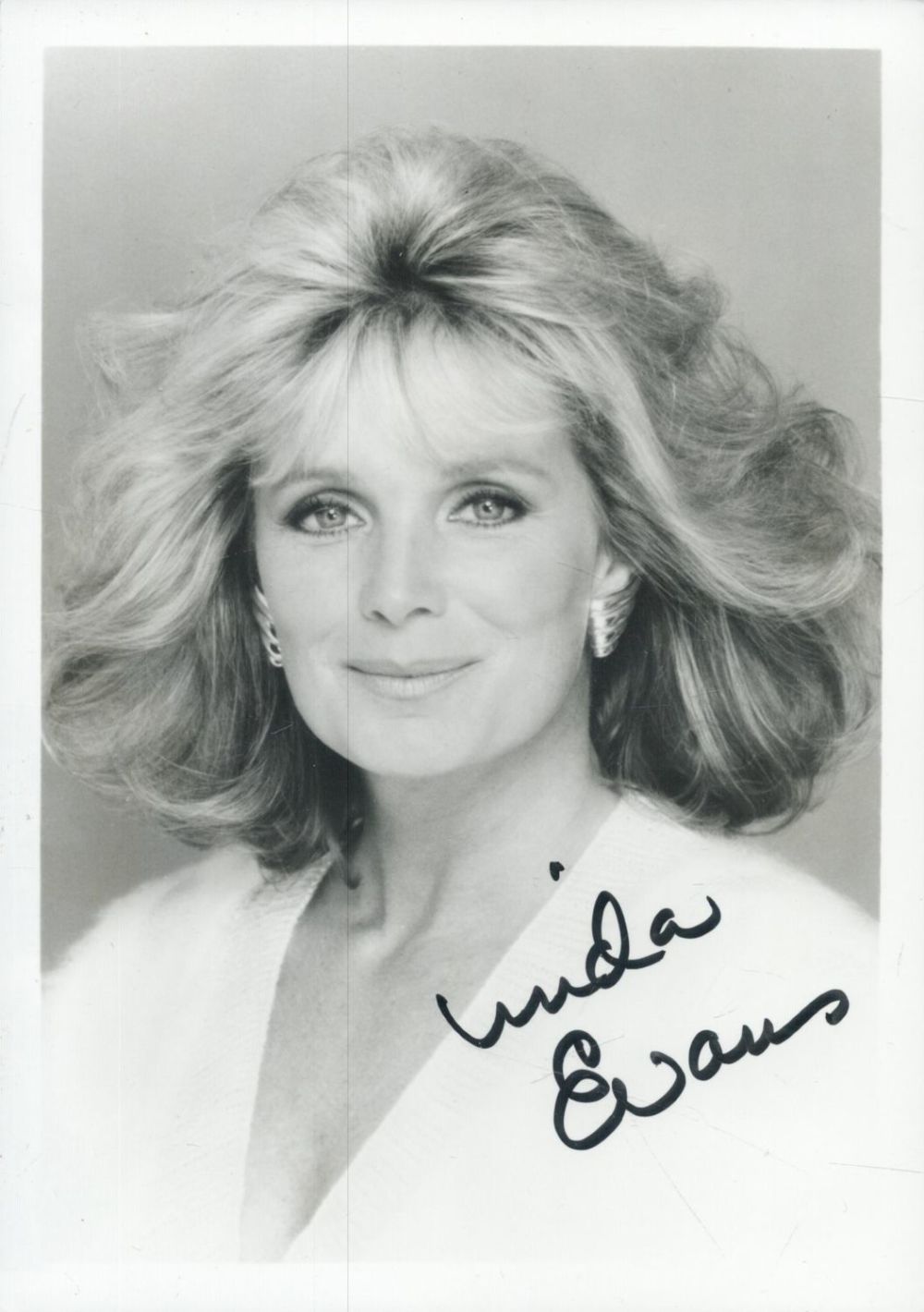 Lot 489: Linda Evans signed 7x5inch black and white photo....