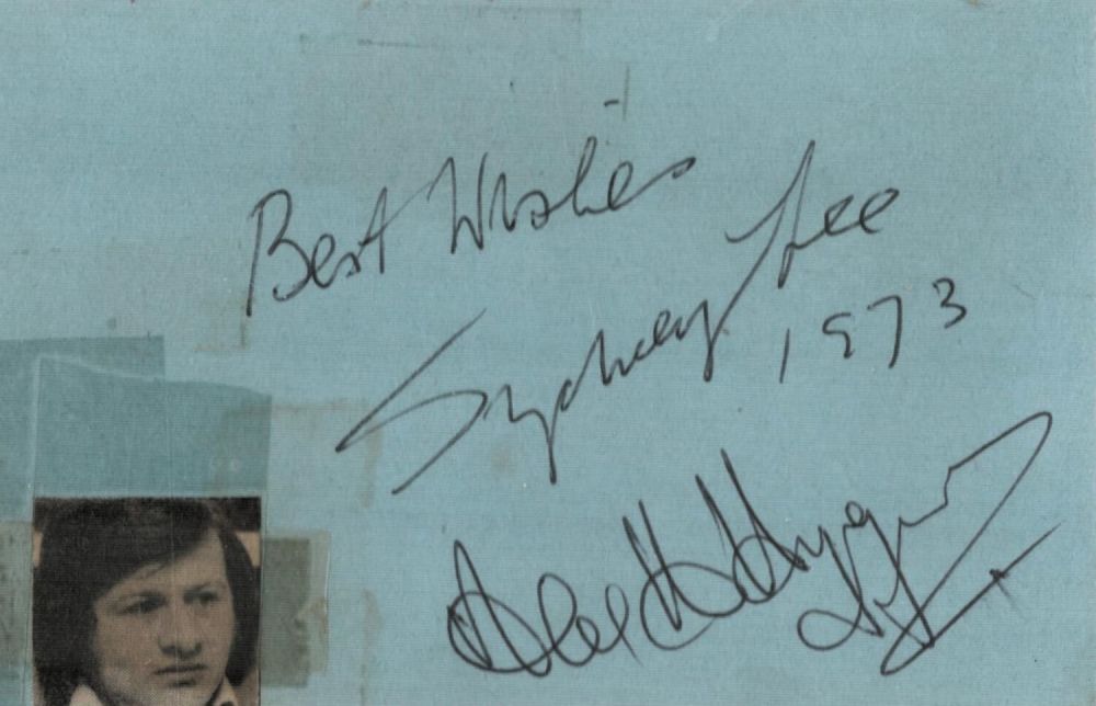 Lot 195: Alex Higgins signed album page. Some tape marks....