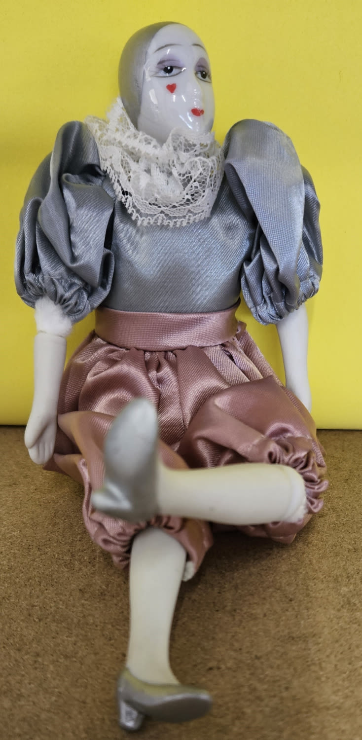 Lot 224: Vintage small porcelain clown doll in grey &...