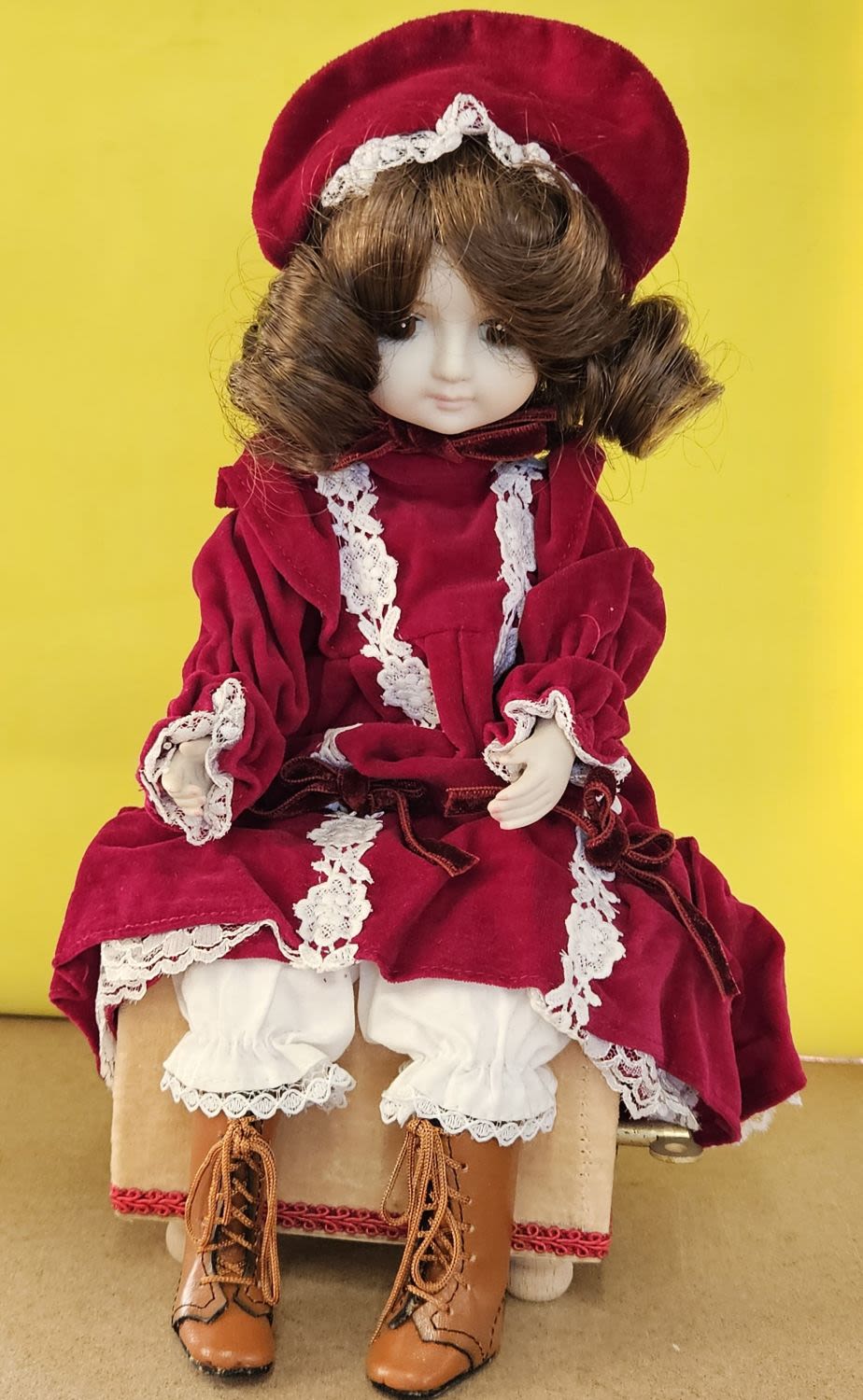 Lot 227: Vintage Porcelain medium size wind-up musical Doll head...