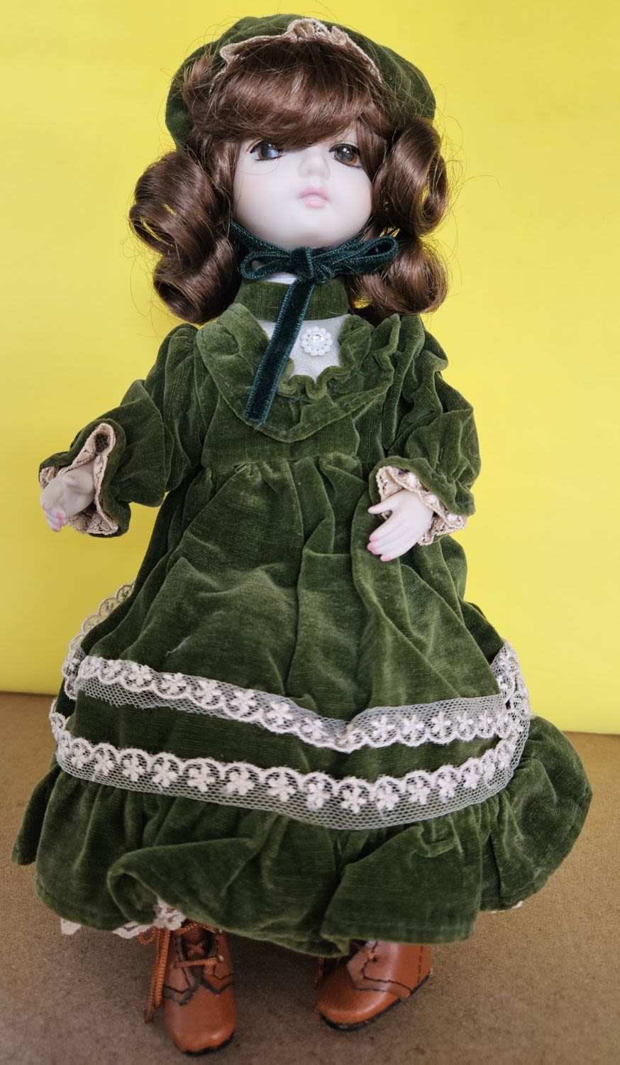 Lot 230: Vintage Porcelain medium size wind-up musical Doll head...