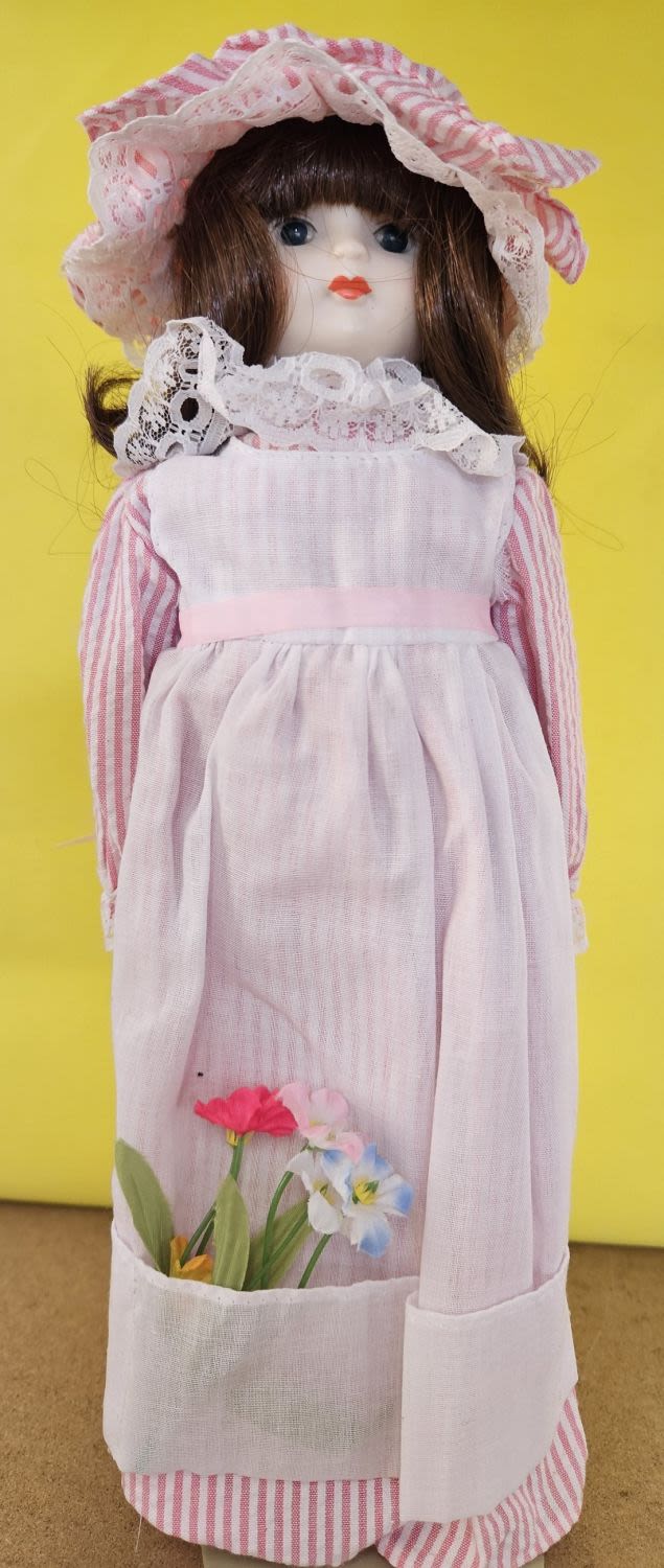 Lot 233: Vintage Porcelain Doll 13 Inch Tall, stuffed body...