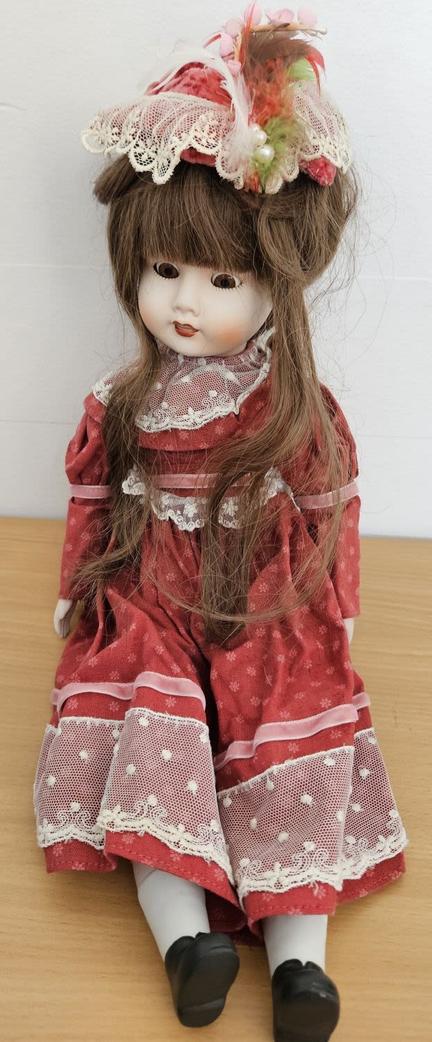 Lot 234: Vintage Porcelain Doll 19 Inch Tall, stuffed body...