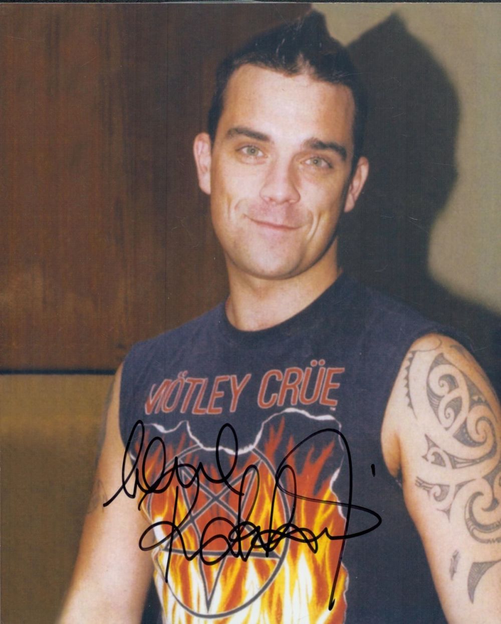 Lot 62: Robbie Williams signed 10x8 inch colour photo. Good...