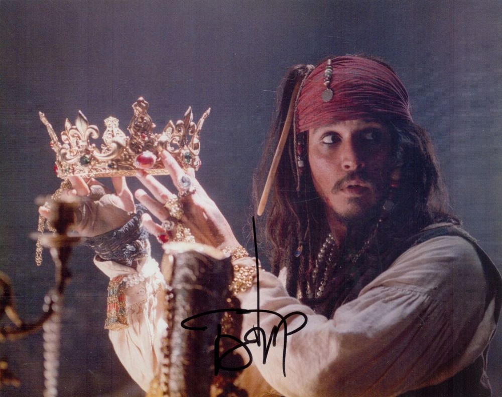 Lot 74: Johnny Depp signed Pirates of the Caribbean 10x8...