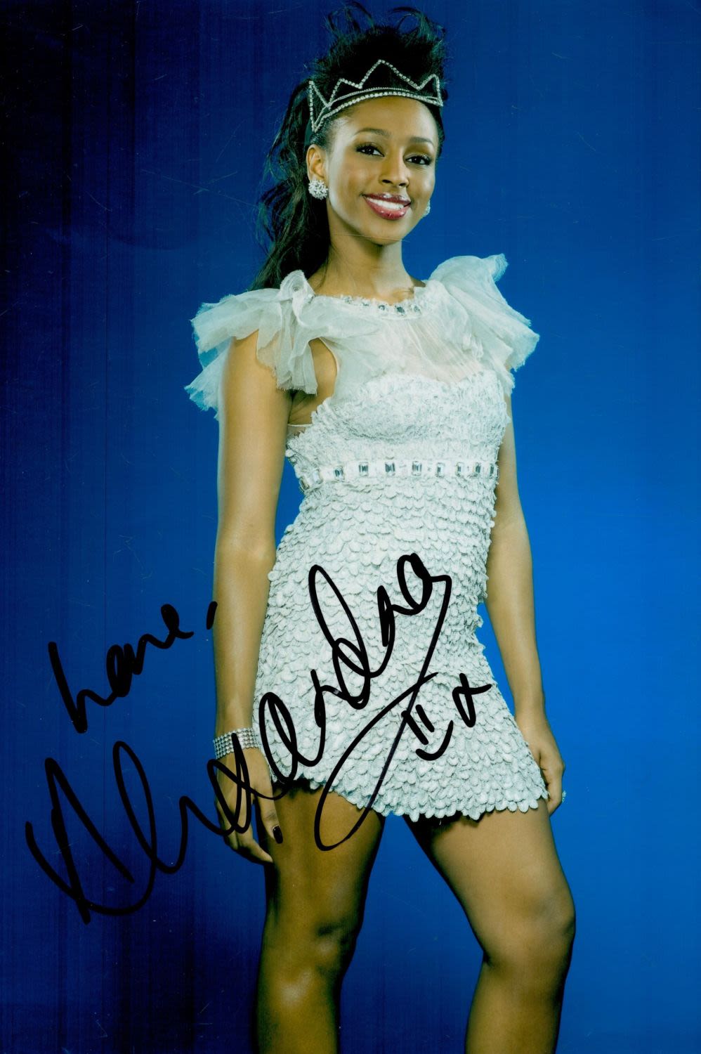 Lot 329: Alexandra Burke signed 12x8inch colour photo. Good condition....