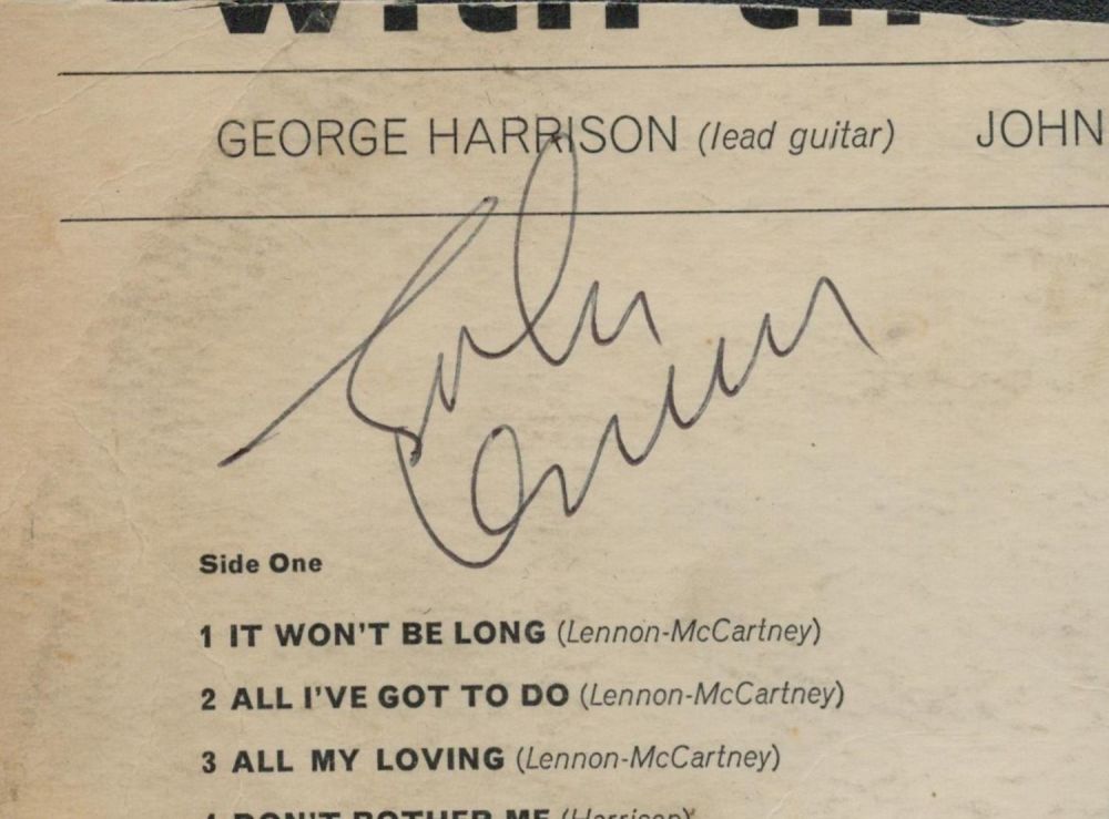 Lot 52: John Lennon signed 3x4 cutout album page. Good...