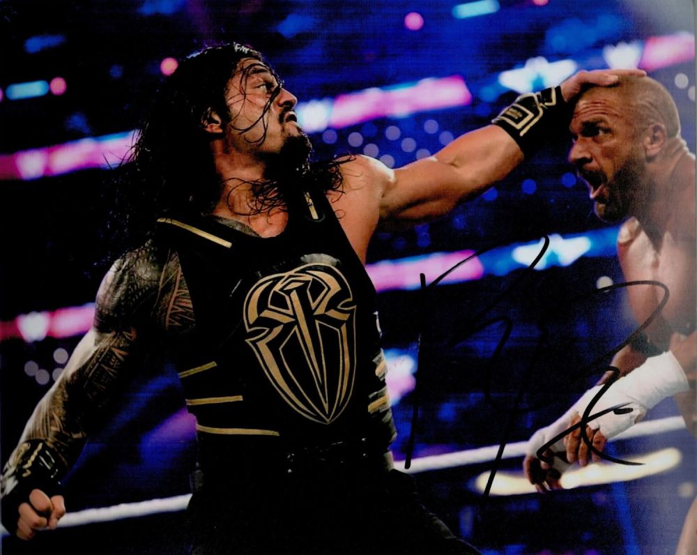 Lot 329: Roman Reigns signed Colour Photo 10x8 Inch. An...