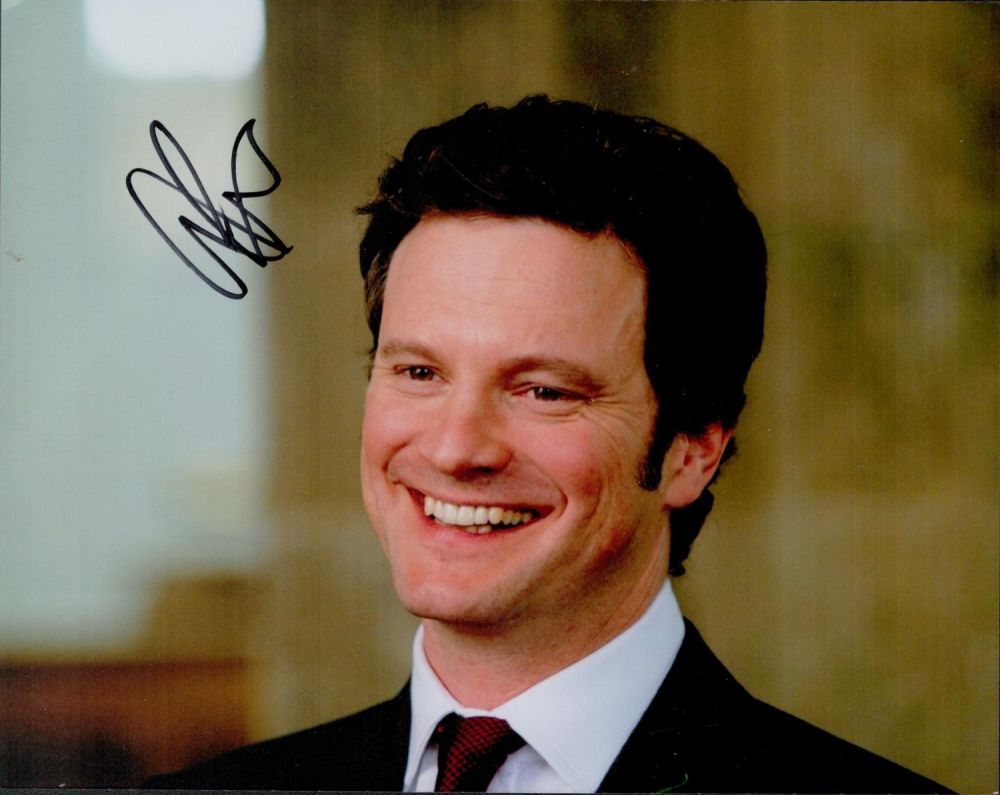 Lot 701: Colin Firth signed 10x8inch colour photo. Good condition....