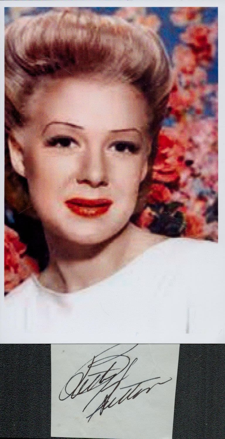 Lot 747: Betty Hutton small, clipped signature with unsigned colour...