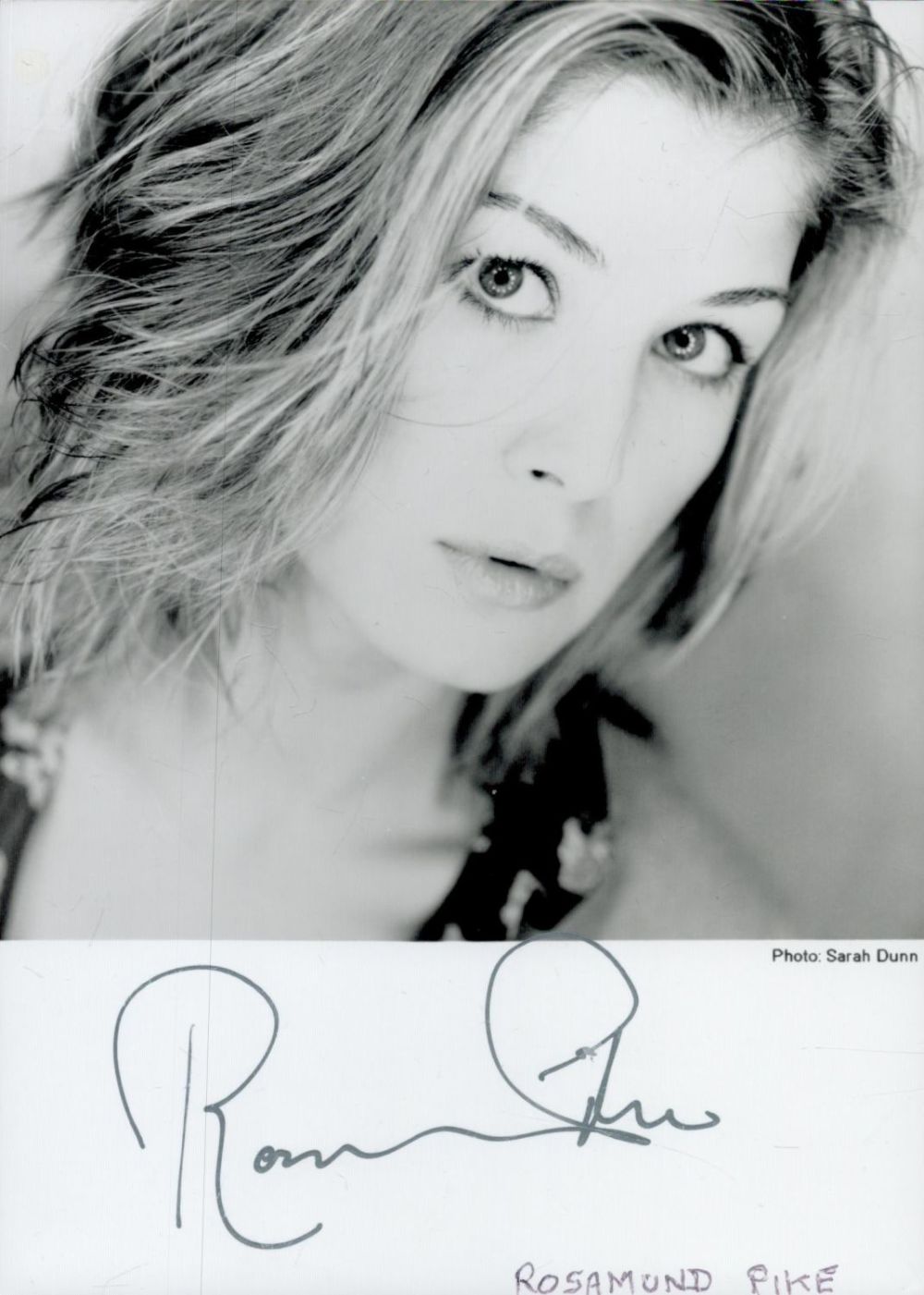 Lot 113: Rosamund Pike signed 6x4 inch black and white...