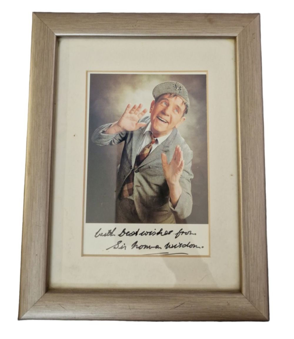 Lot 171: Sir Norman Wisdom signed colour photo. Mounted and...