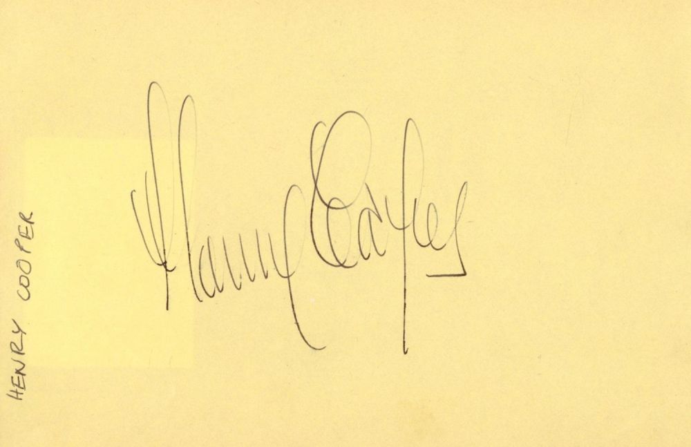 Lot 151: Henry Cooper signed 6x4 album page. Good condition....