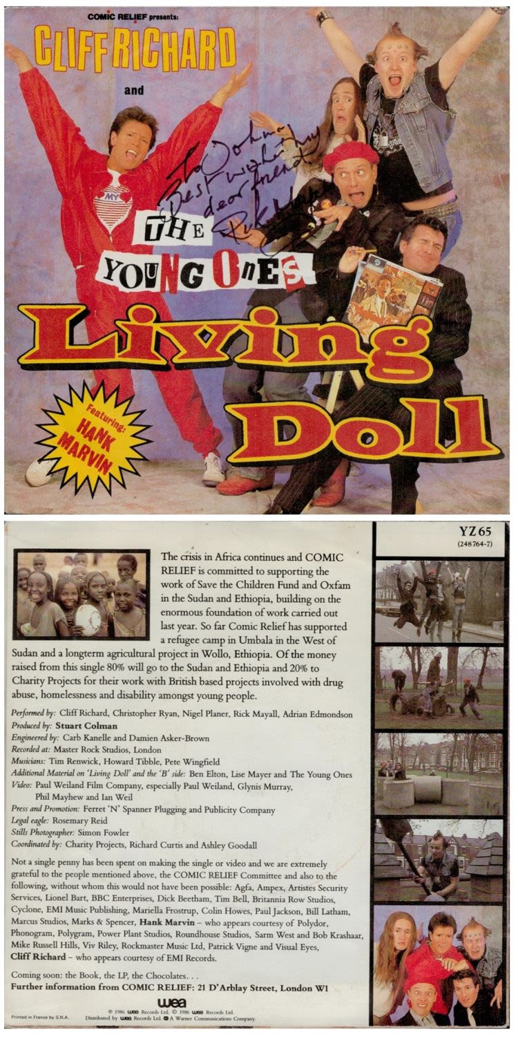 Lot 211: Rik Mayall signed The Young Ones Living Doll...
