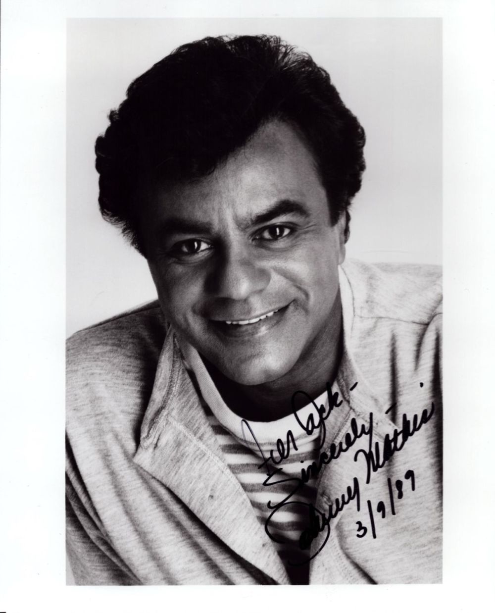 Lot 498: Johnny Mathis signed 10x8 inch black and white...
