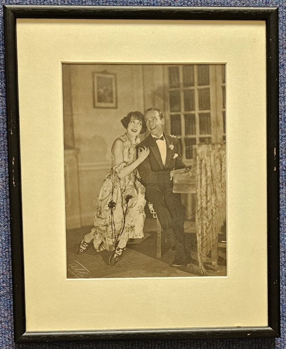 Lot 667: Fred Astaire signed vintage sepia photo. Mounted and...
