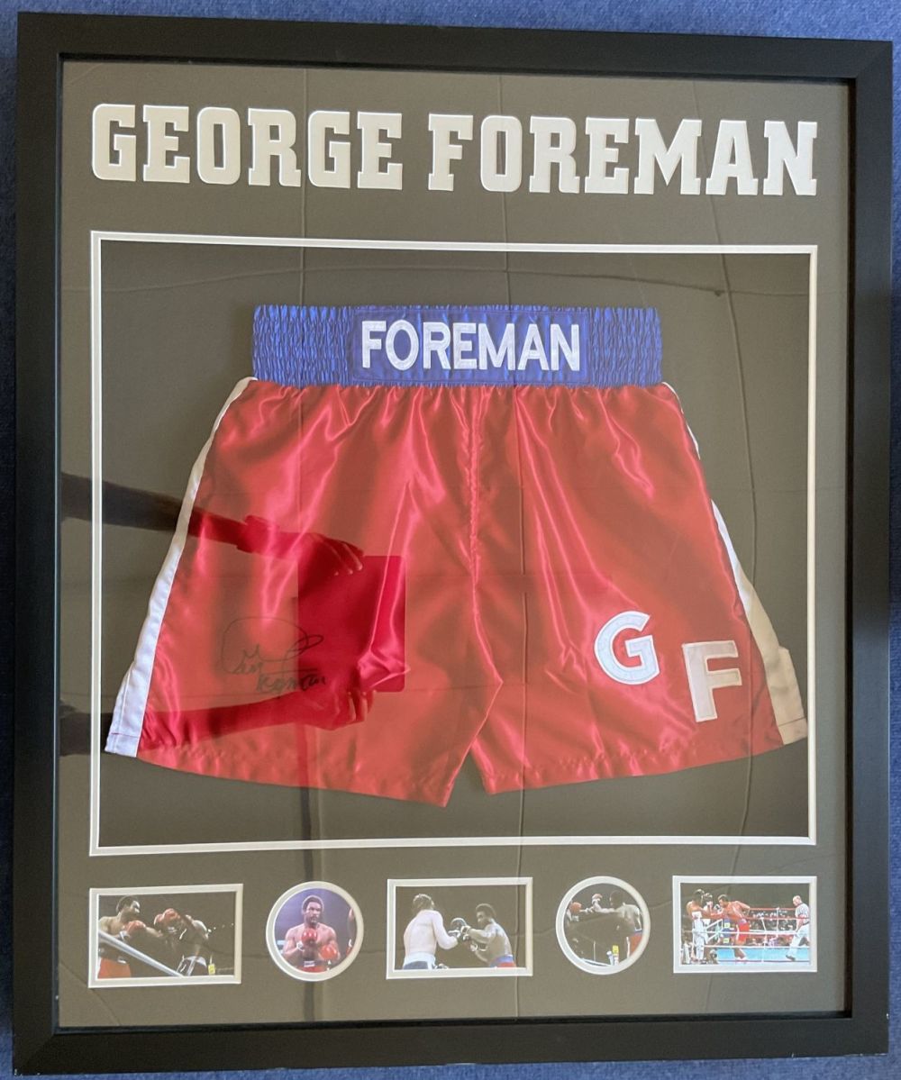 Lot 170: Boxing George Foreman signed 33x38 boxing shorts display....