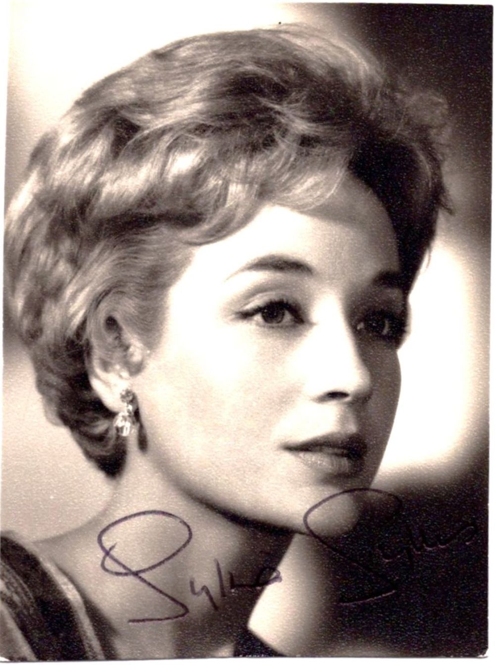 Lot 331: Sylvia Syms signed 3x2inch black and white photo....