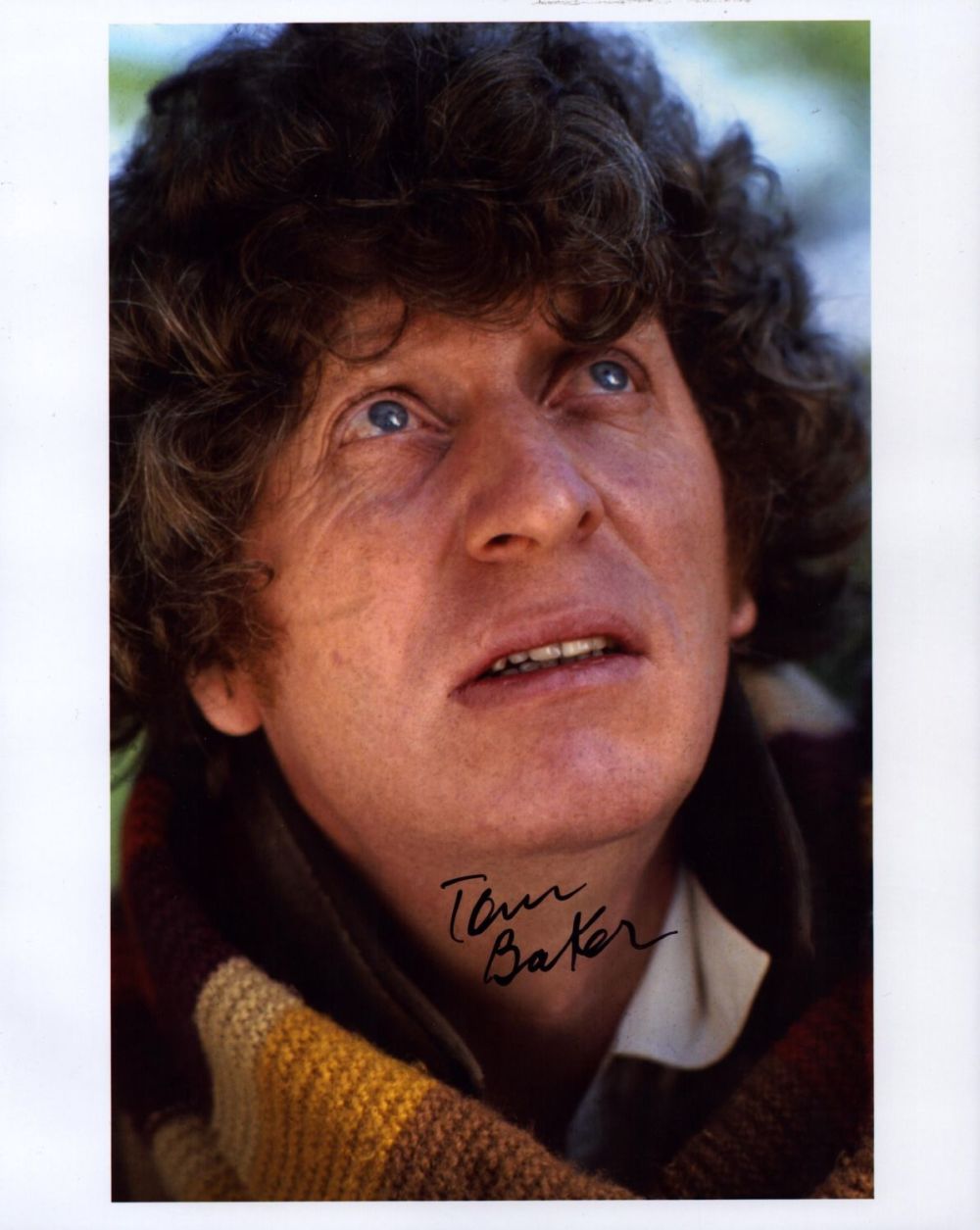 Lot 683: Tom Baker signed 10x8 inch colour photo. Good...