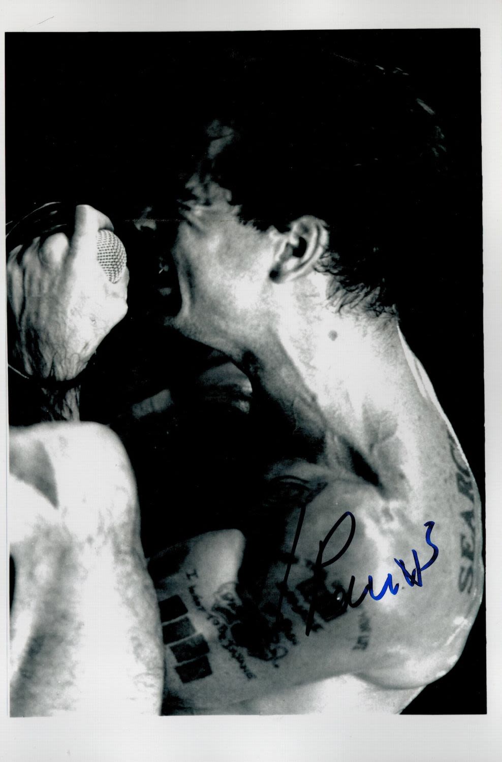 Lot 451: Henry Rollins signed 11x7 black and white photo....