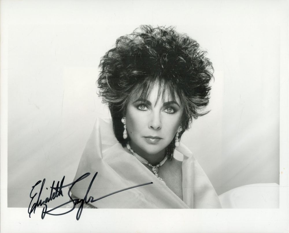 Lot 56: Elizabeth Taylor signed 10x8 inch black and white...