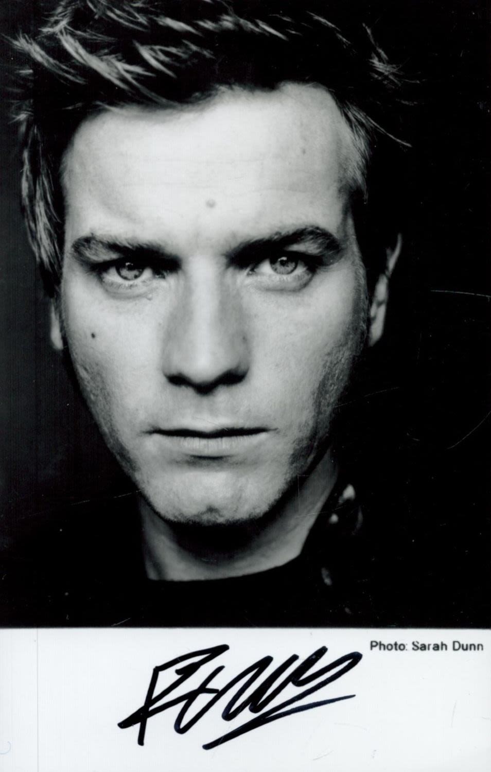 Lot 428: Ewan McGregor Signed 5.5 x 3.5-inch Black and...