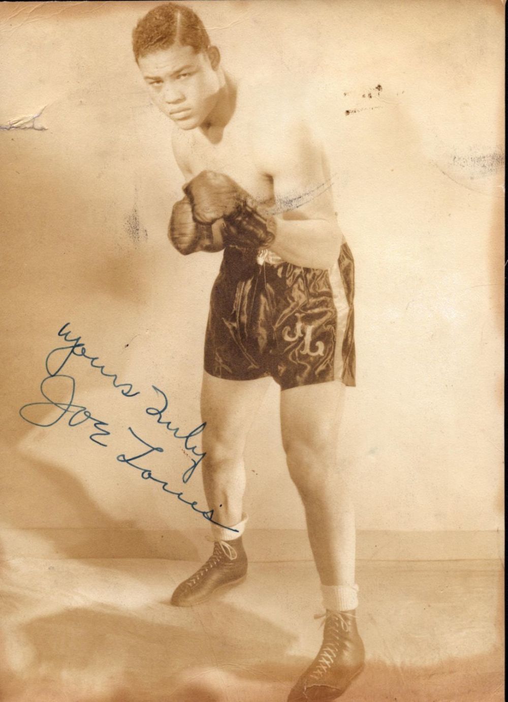Lot 139: Joe Louis signed vintage 9x6 inch approx sepia...