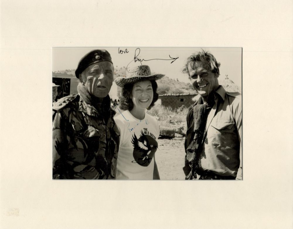 Lot 76: Roger Moore signed 14x11 inch overall mounted Wild...