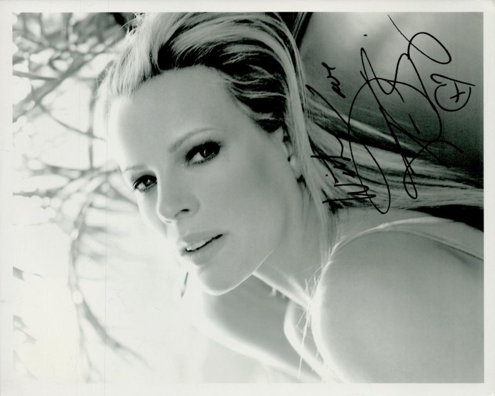 Lot 336: Kim Bassinger signed 10x8 inch black and white...