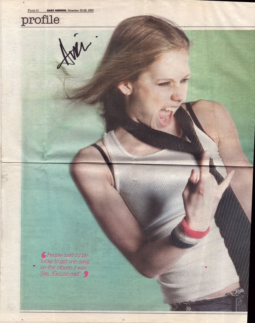 Lot 736: Avril Lavigne signed Newspaper article from 2002. Good...
