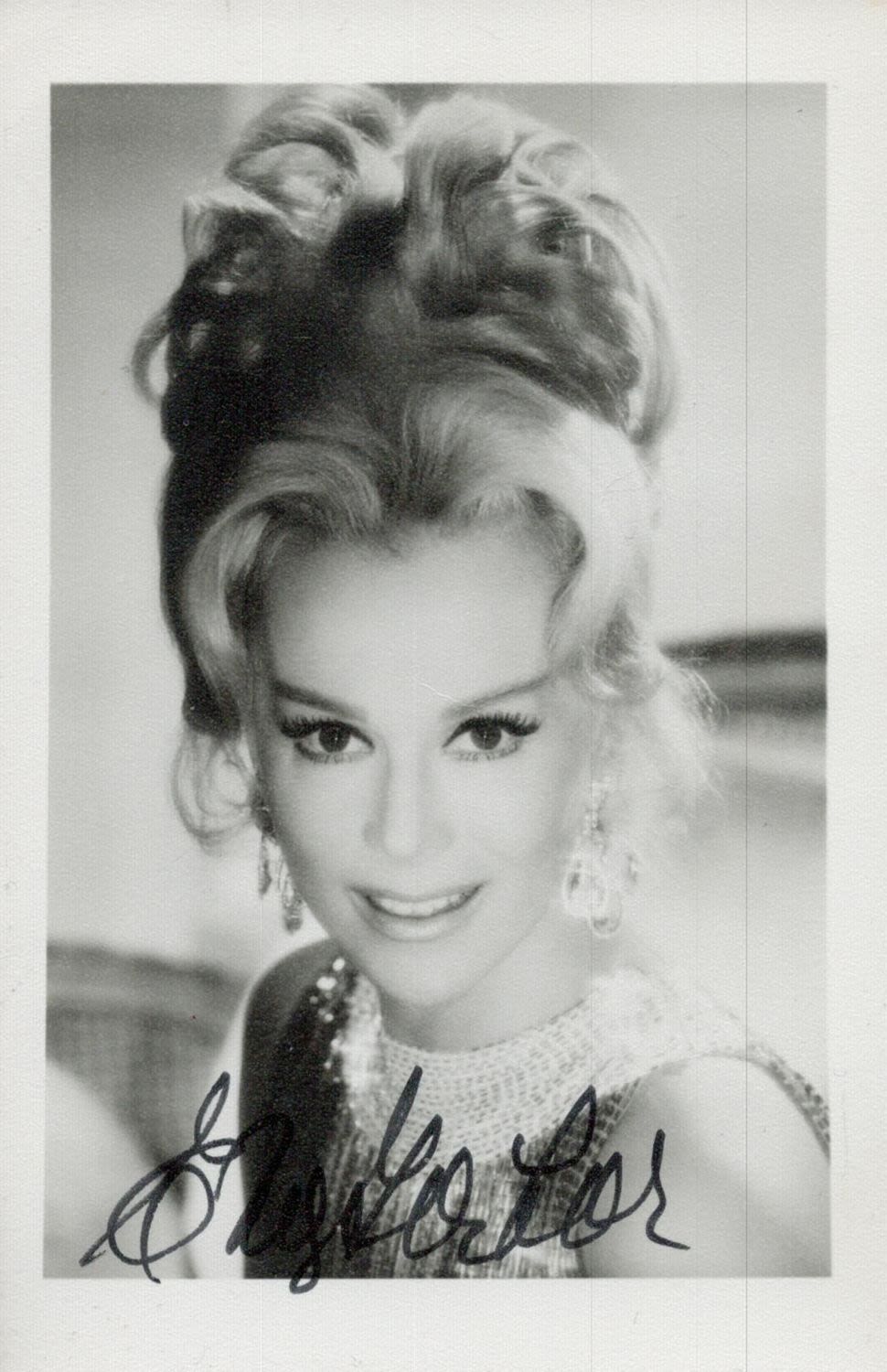 Lot 237: Eva Gabor signed 5x3inch black and white photo....