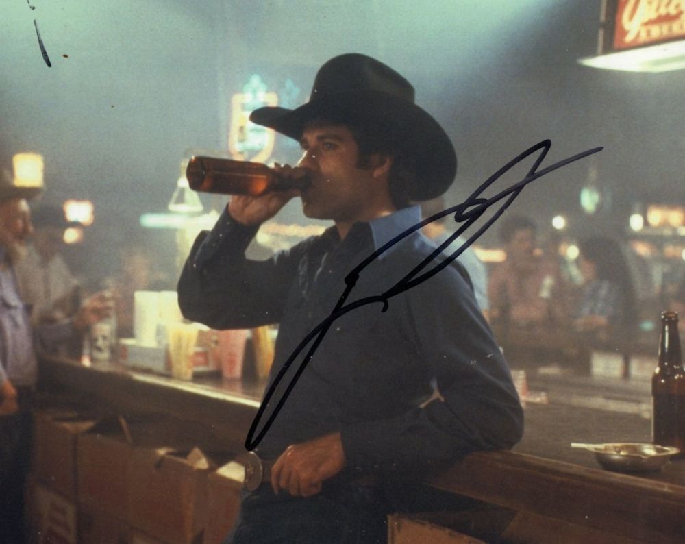 Lot 638: John Travolta signed 8x10 movie scene photo. Good...