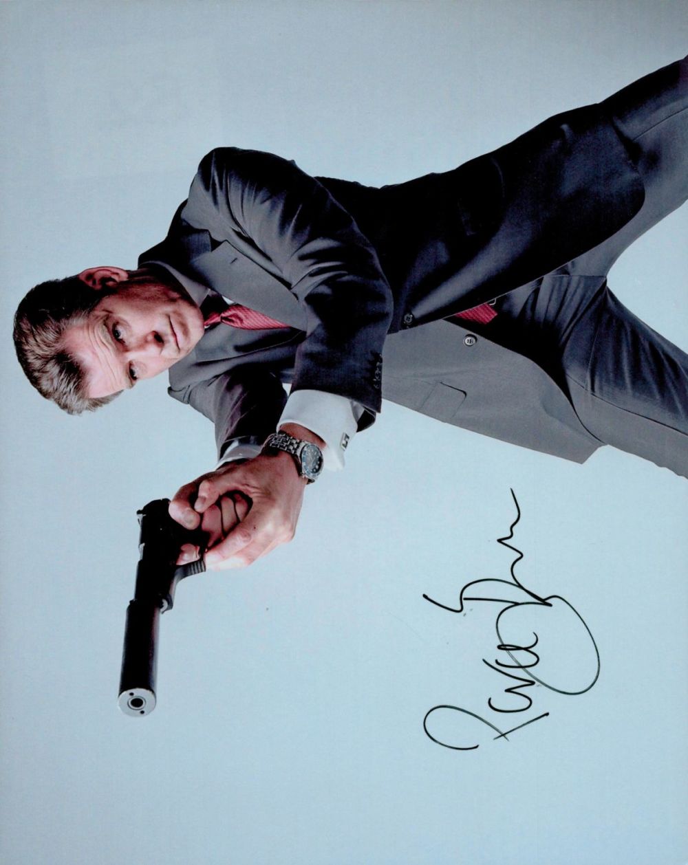 Lot 82: Pierce Brosnan signed 10x8 inch colour photo. Good...