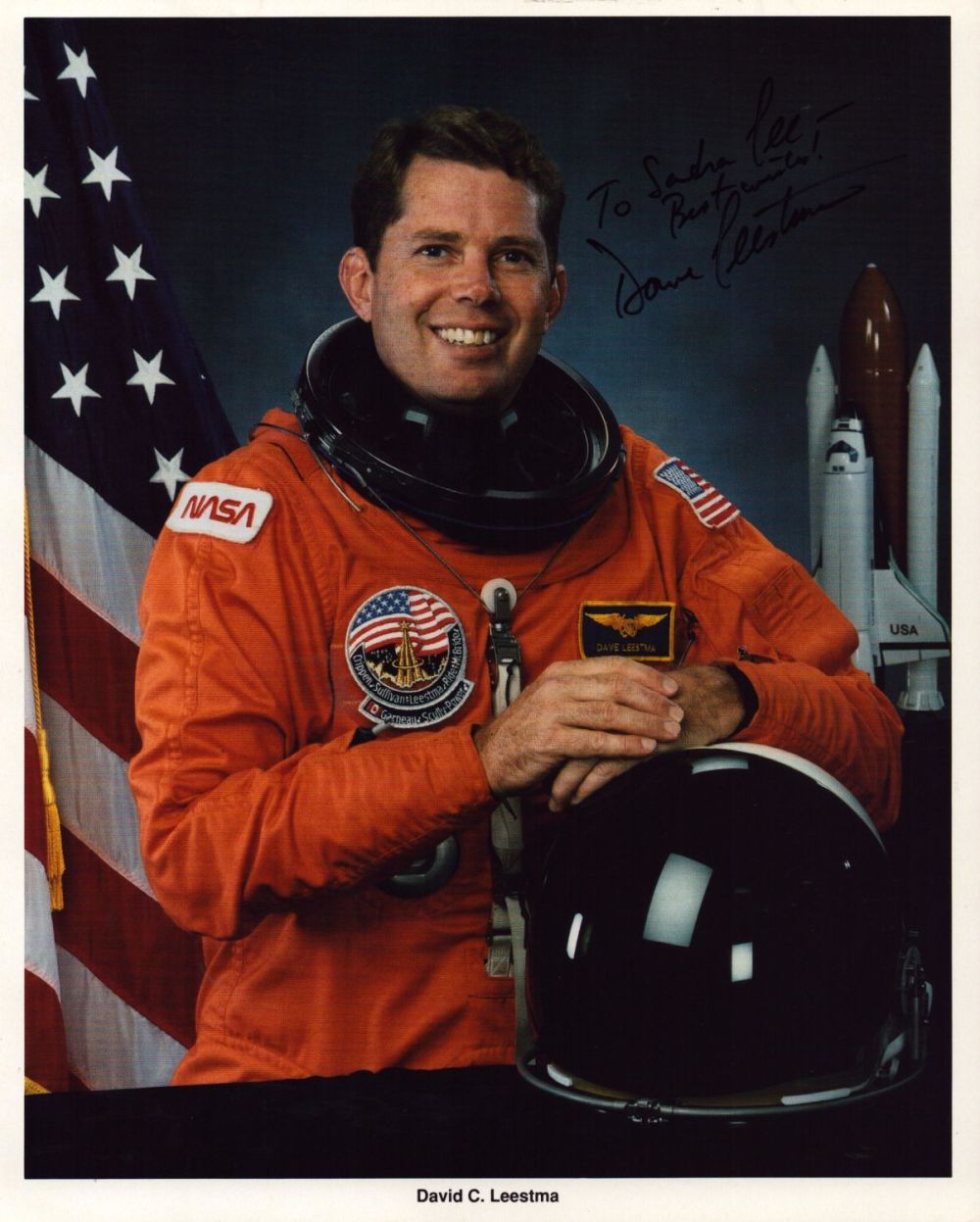 Lot 108: David C Leestma signed 10x8inch official NASA spacesuit...