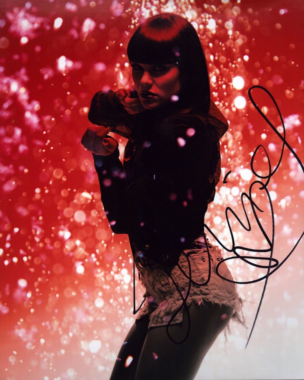 Lot 680: Jessie J signed 10x8 inch colour photo. Good...