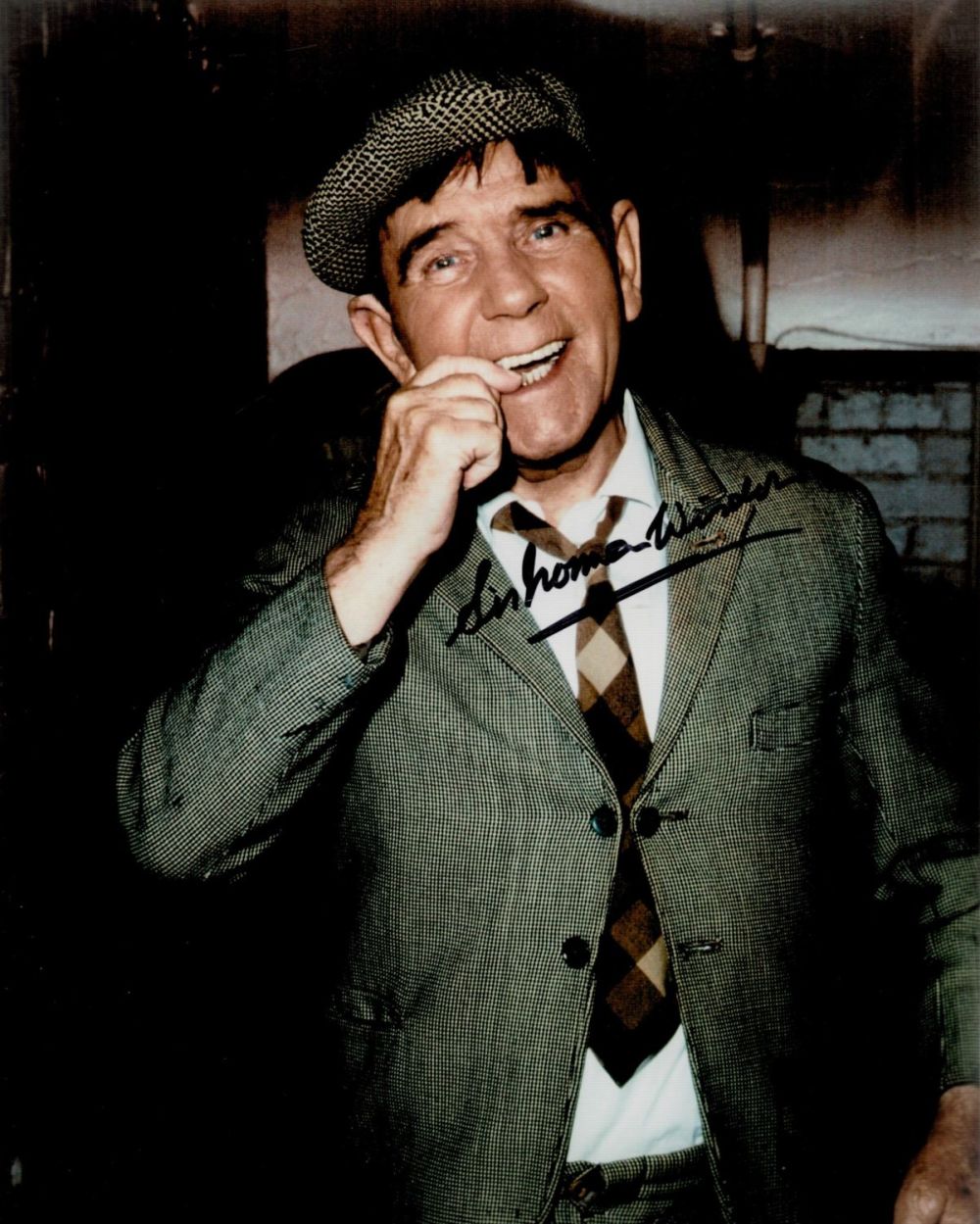 Lot 238: Norman Wisdom signed 10x8 colour photo. Sir Norman...