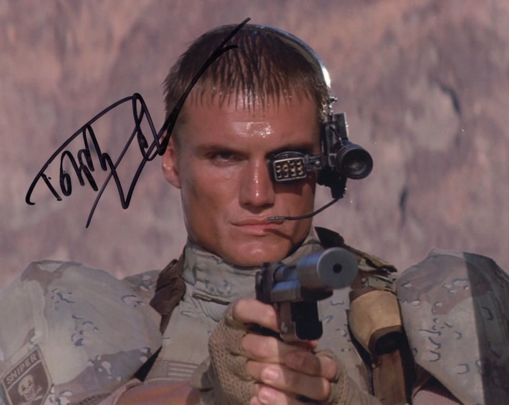 Lot 555: Dolph Lundgren signed 8x10 Universal Soldier movie scene...