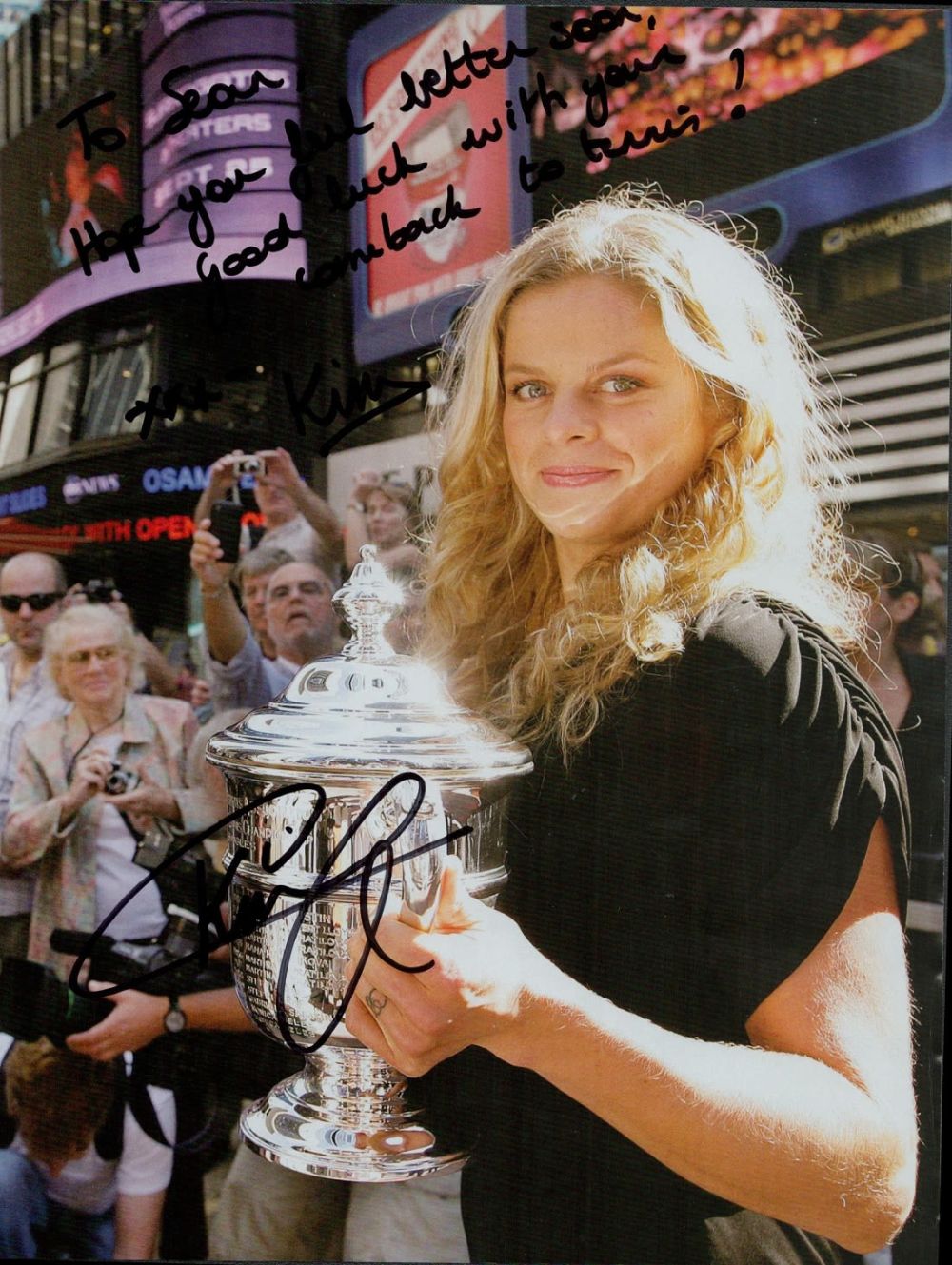 Lot 174: Kim Clijsters signed 11x8 inch colour magazine photo....