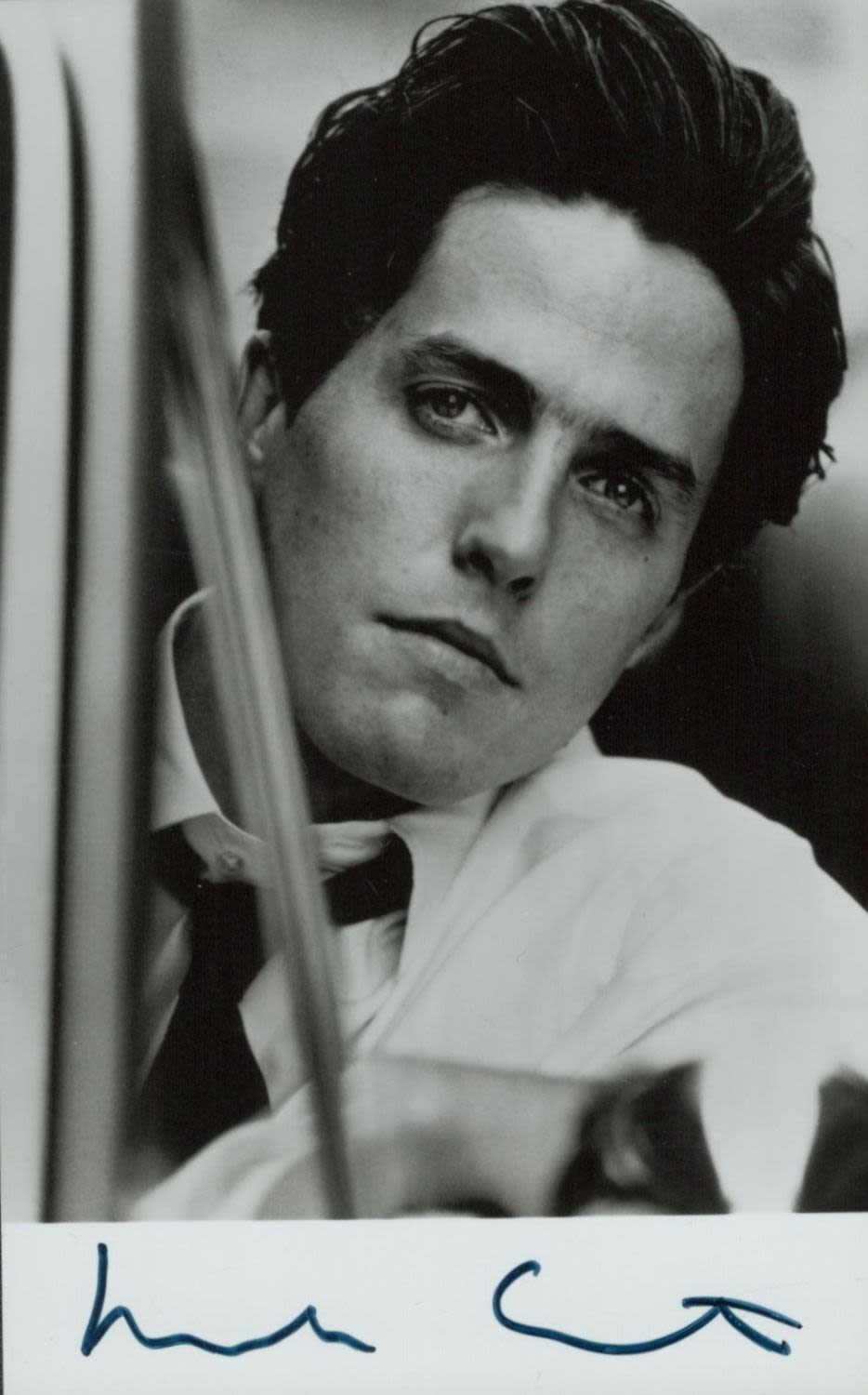 Lot 198: Hugh Grant signed 6x4 inch black and white...