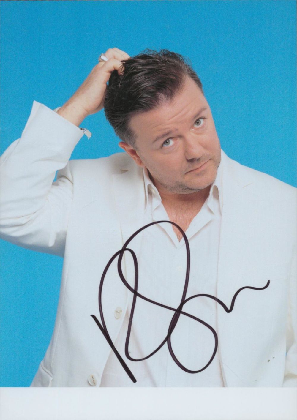 Lot 228: Ricky Gervais signed 7x5 inch colour photo. Good...