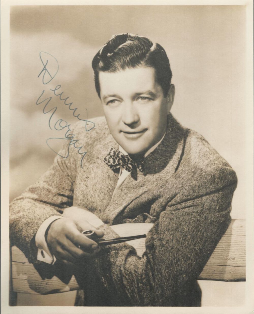 Lot 316: Dennis Morgan signed 10x8inch sepia photo. Good Condition....