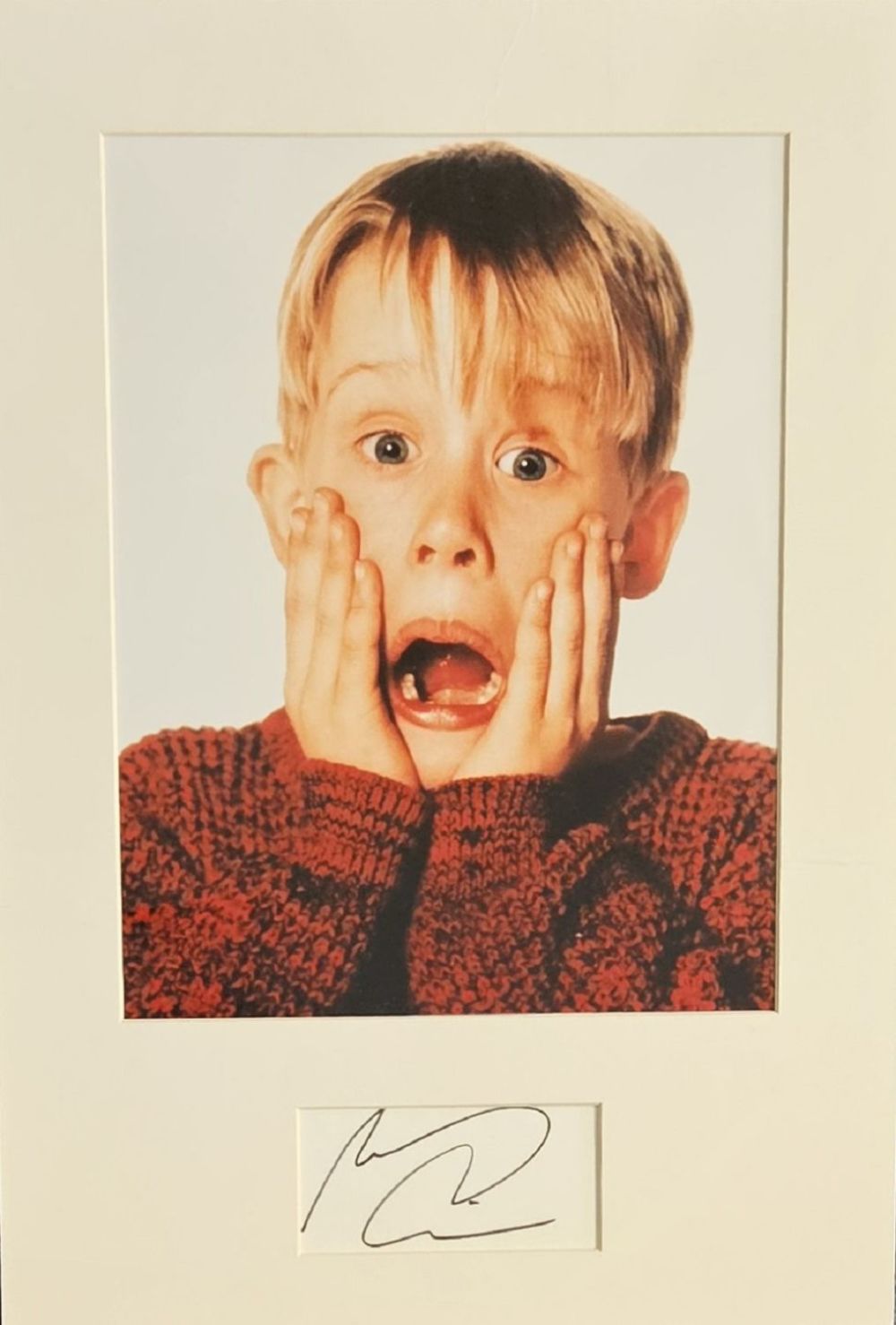 Lot 394: Macaulay Culkin signed white card mounted below colour...