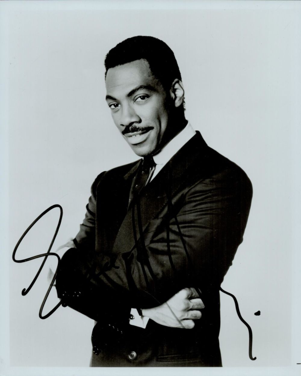 Lot 415: Eddie Murphy signed 10x8" black and white photo....