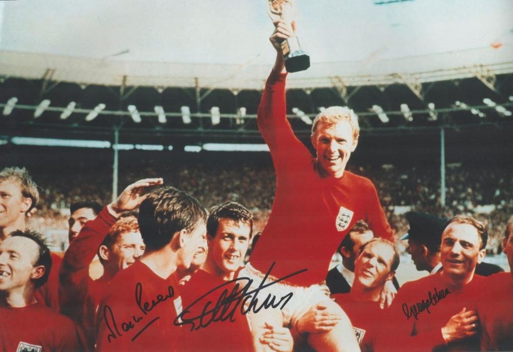 Lot 679: Geoff Hurst, Martin Peters and George Cohen signed...