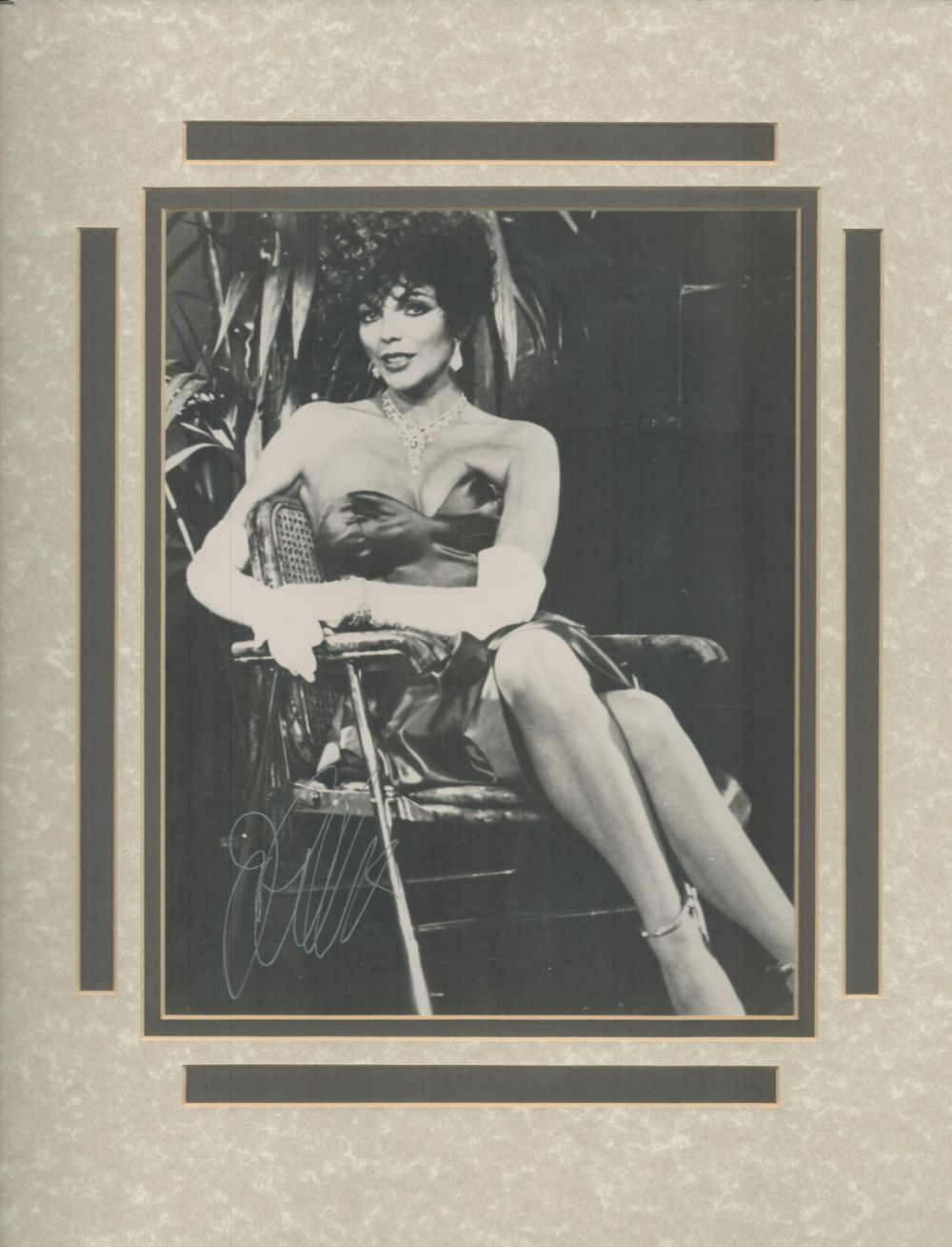 Lot 127: Joan Collins signed 15x13inch black and white mount....