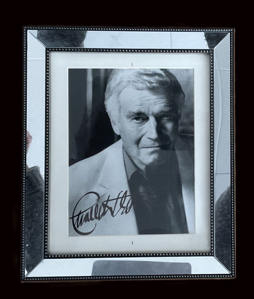 Lot 235: Charlton Heston secretarial signed black and white photo...