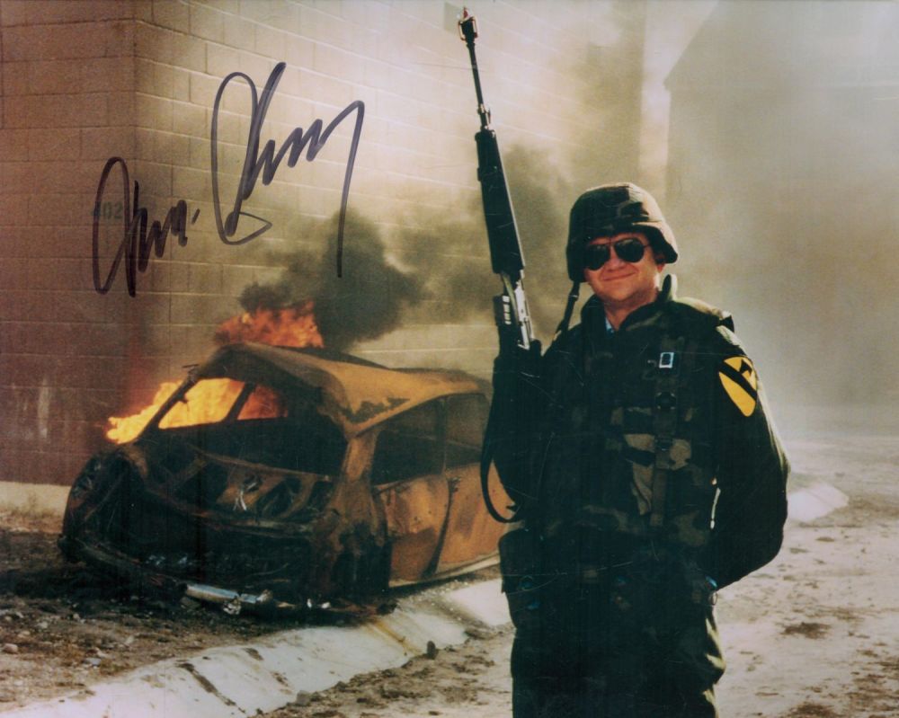 Lot 239: Tom Clancy signed 10x8 inch colour photo. Good...
